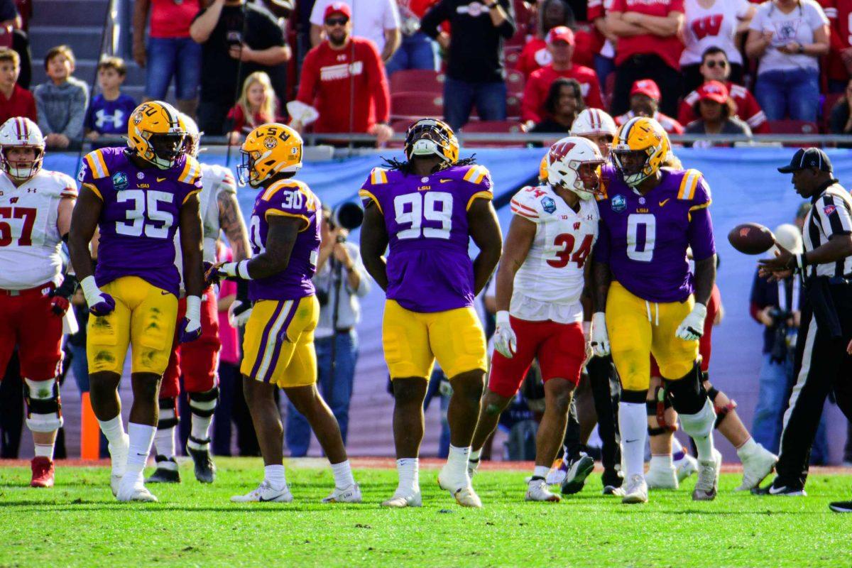 LSU football senior defensive tackle Jordan Jefferson (99) celebrates a defensive stop on Monday, Jan. 1, 2024, during LSU's 35-31 victory against Wisconsin in Raymond James Stadium in Tampa, Fl.