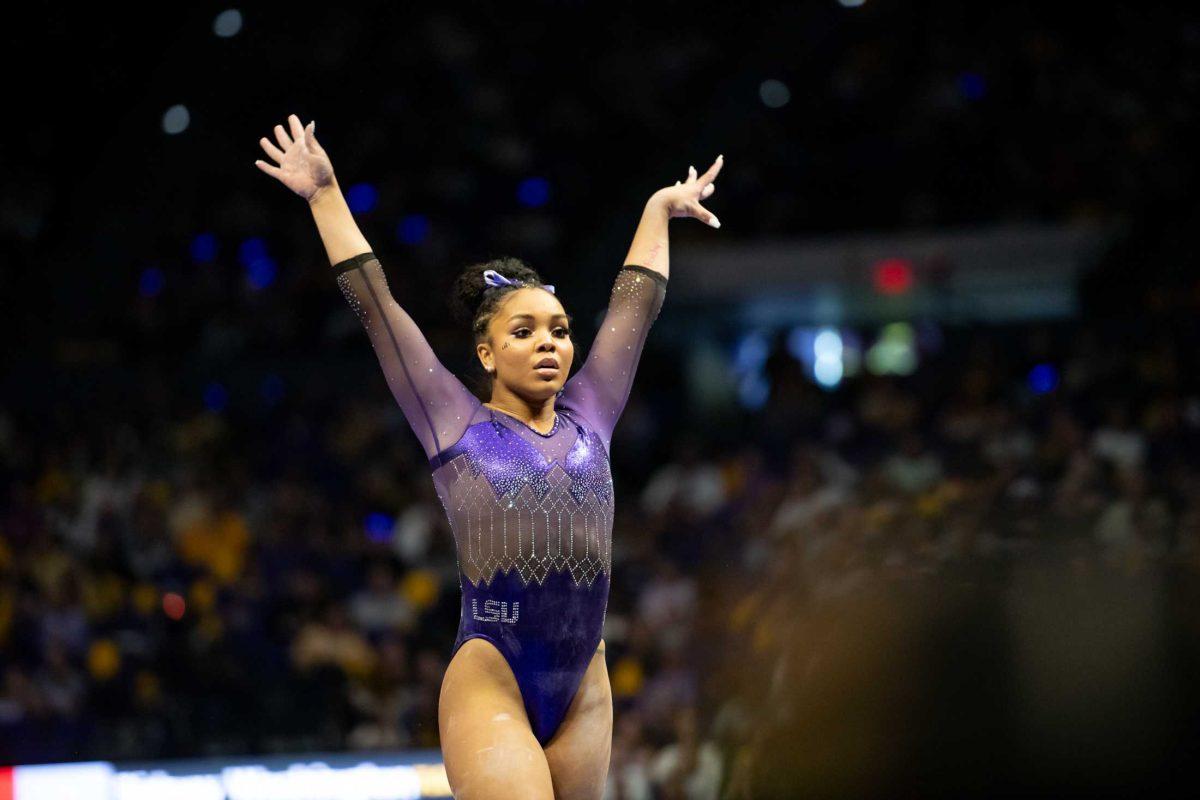 LSU gymnastics all-around freshman Konnor McClain strikes a pose during her balance beam routine Friday, Jan. 5, 2024, during LSU&#8217;s 196.975-196.775 victory over Ohio State in the Pete Maravich Assembly Center in Baton Rouge, La.