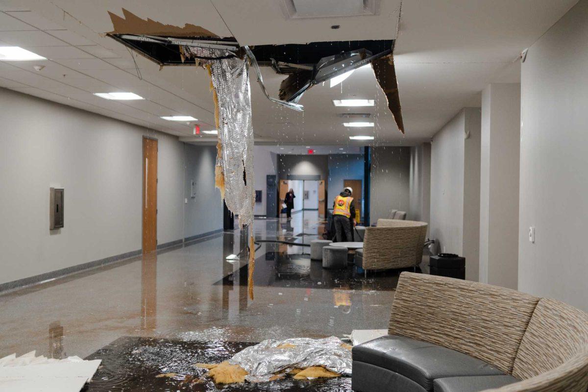 Water drips from a hole in the ceiling Wednesday, Jan. 17, 2024, inside Patrick F. Taylor Hall on LSU's campus in Baton Rouge, La.