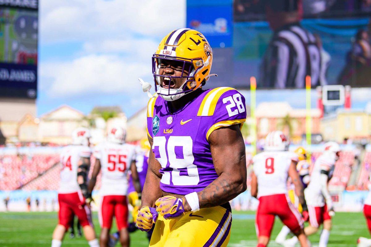 LSU football freshman running back Kaleb Jackson (28) celebrates a touchdown on Monday, Jan. 1, 2023 during LSU's 35-31 win against Wisconsin in Raymond James Stadium in Tampa, Fl.