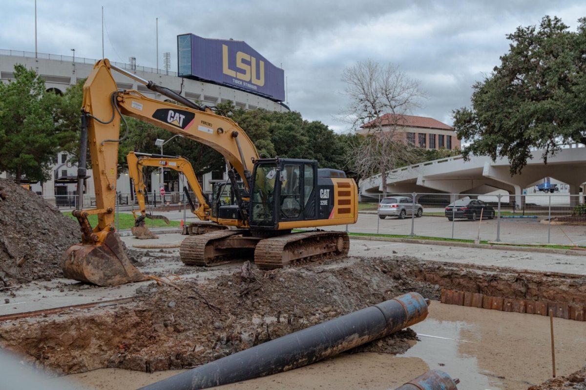 An excavator sits near a hole Saturday, Jan. 27, 2024, on LSU's campus in Baton Rouge, La.