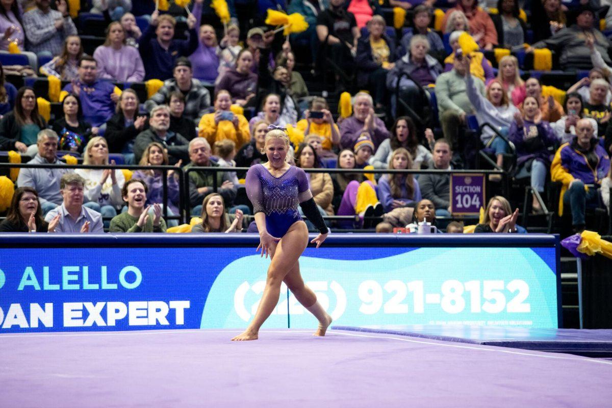 LSU gymnastics vault/balance beam/floor exercise graduate student Sierra Ballard smiles after a successful landing Friday, Jan. 5, 2024, during LSU&#8217;s 196.975-196.775 victory over Ohio State in the Pete Maravich Assembly Center in Baton Rouge, La.