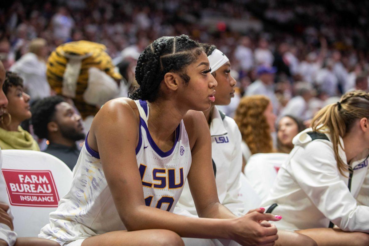 LSU women's basketball junior forward Angel Reese (10) watches her teammates from the sidelines during LSU's 76-70 loss against South Carolina Thursday, Jan. 25, 2024, at the Pete Maravich Assembly Center on North Stadium Dr. in Baton Rouge, La.