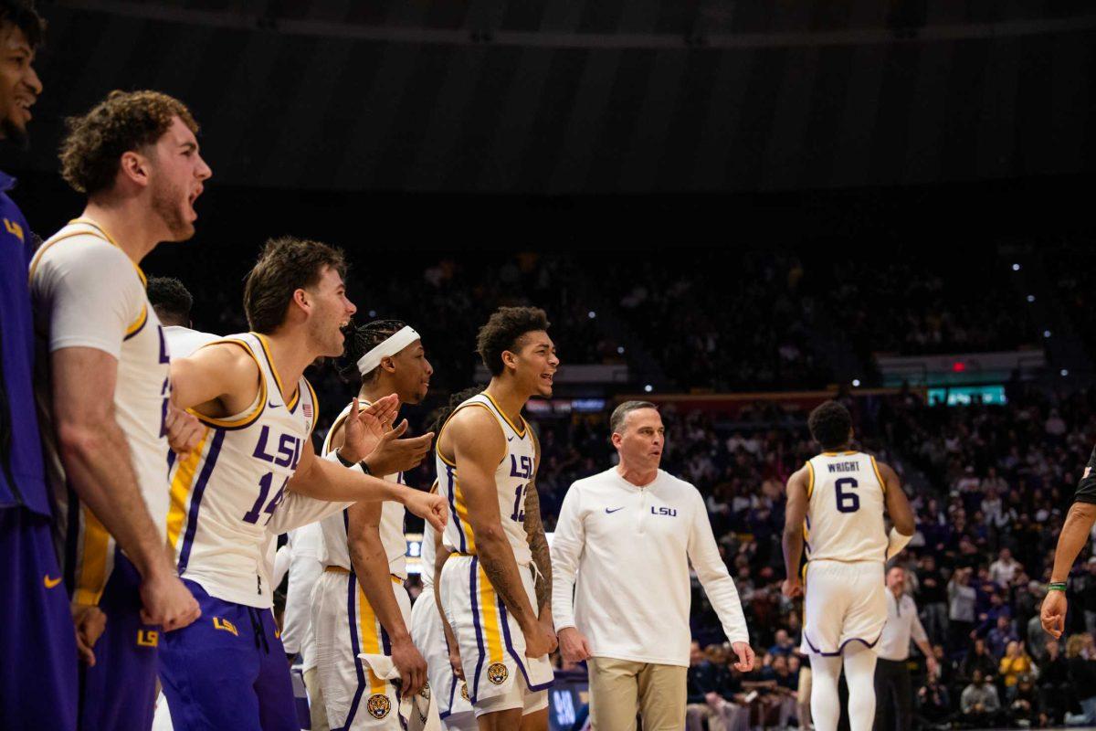 The LSU men&#8217;s basketball team cheers from the side on Wednesday, Jan. 17, 2024, during LSU's 89-80 win against Ole Miss in the Pete Maravich Assembly Center in Baton Rouge, La.