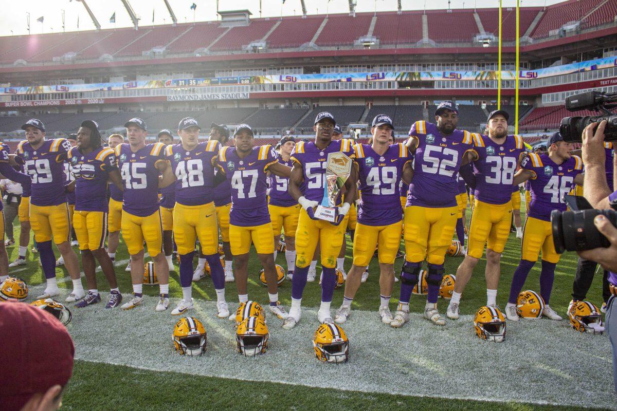 LSU football players sing the LSU Alma Mater Monday, Jan. 1, 2024, following LSU's 35-31 win over Wisconsin at the Raymond James Stadium in Tampa, Fl.