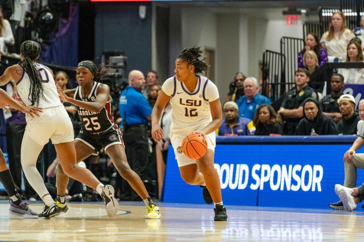 <p>LSU women’s basketball freshman guard Mikaylah Williams (12) dribbles the ball Thursday, Jan. 25, 2024, during LSU’s 76-70 loss against South Carolina in the Pete Maravich Assembly Center in Baton Rouge, La.</p>