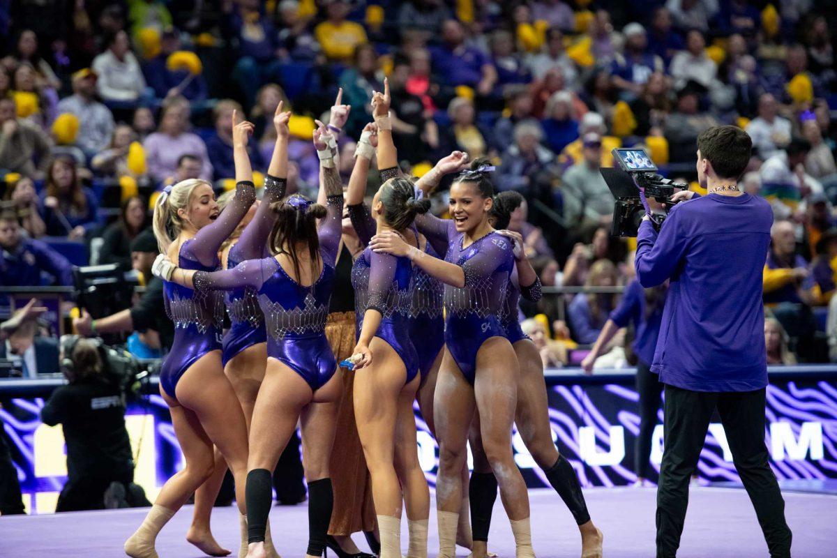 LSU gymnastics team huddles Friday, Jan. 5, 2024, during LSU&#8217;s 196.975-196.775 victory over Ohio State in the Pete Maravich Assembly Center in Baton Rouge, La.