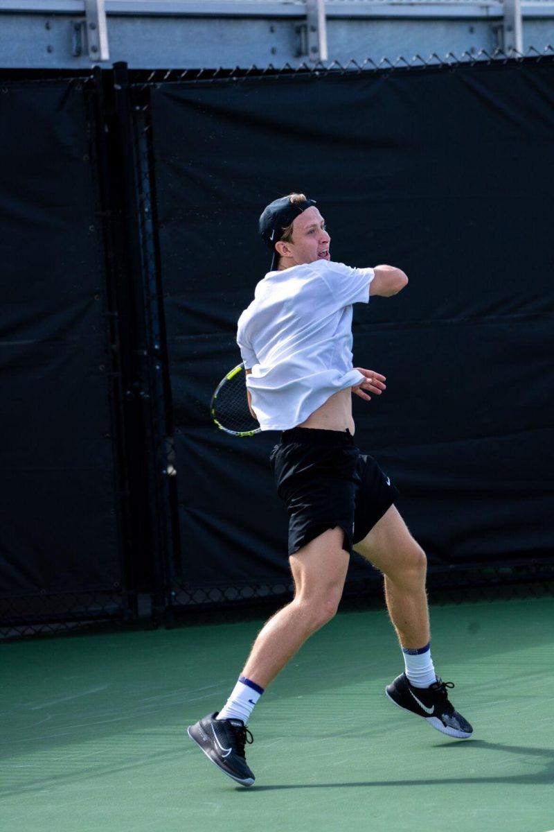 LSU men's tennis junior Julien Penzlin hits a forehand during his 7-6, 6-3 singles win against Rice Sunday, Feb. 4, 2023 at the LSU Tennis Complex on Gourrier Avenue in Baton Rouge, La.