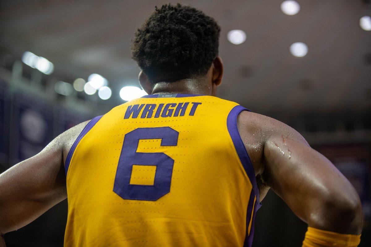 LSU men's basketball graduate student guard Jordan Wright (6) watches his teammates from the sidelines on Saturday, Feb. 3, 2024, during LSU's 94-74 win against Arkansas in the Pete Maravich Assembly Center in Baton Rouge, La.