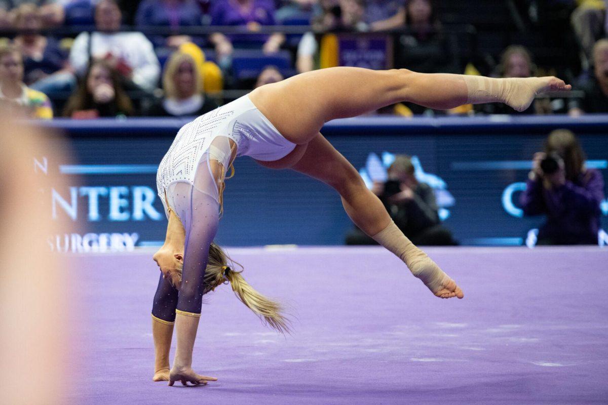 LSU gymnastics all-around senior Olivia Dunne flips during her floor exercise Friday, Feb. 2, 2024, during LSU&#8217;s 198.475-196.200 win against Arkansas at the Pete Maravich Assembly Center in Baton Rouge, La.