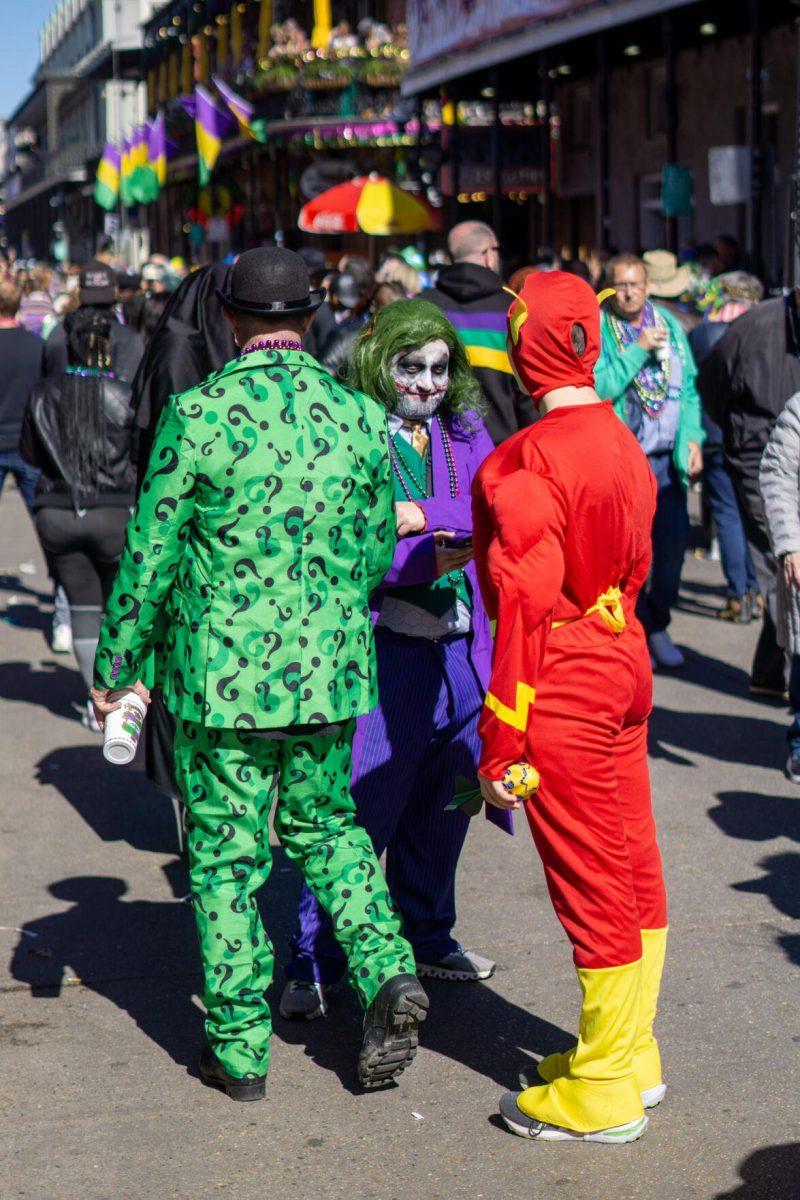 The Joker, Flash and Riddler plan their next move Tuesday, Feb. 13, 2024, on Bourbon Street in New Orleans, La.