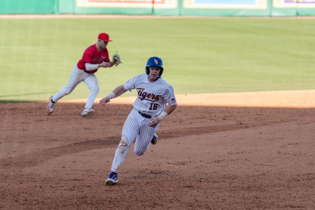 LSU baseball sophomore catcher Brady Neal (16) runs to third base Friday, Feb. 23, 2024, during LSU&#8217;s 5-2 loss against Stony Brook at Alex Box Stadium in Baton Rouge, La.