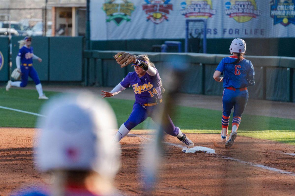 LSU softball graduate student utility Raeleen Gutierrez (55) stretches to catch the ball Friday, Feb. 23, 2024, during LSU&#8217;s 8-5 win over Boise State at Tiger Park in Baton Rouge, La.