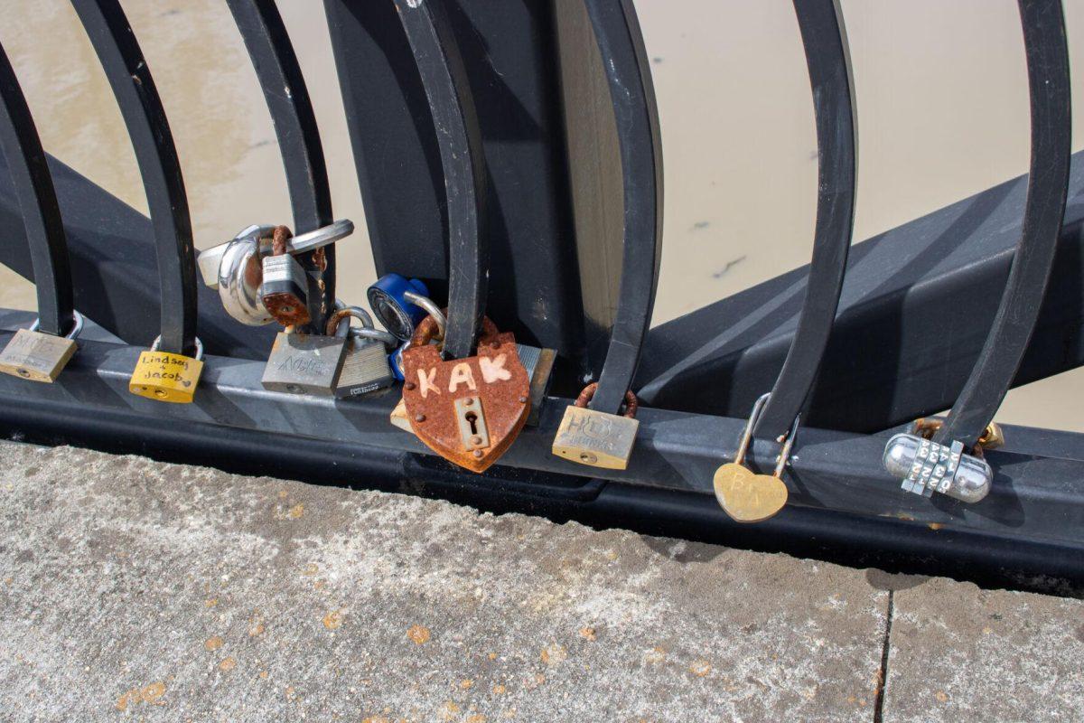 The locks people have placed are labeled with different names and intials on Thursday, Feb. 8, 2024, at Milford Wampold Memorial Park on Standford Ave. in Baton Rouge, La.