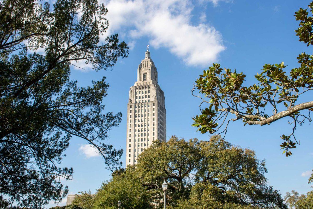 The top of the State Capitol peaks through the trees on Wednesday, Feb. 21, 2024, in Baton Rouge, La.