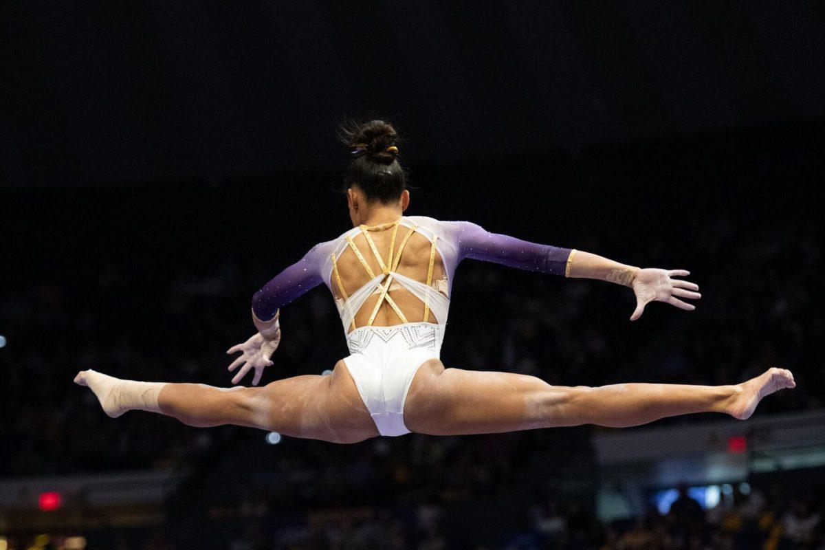 LSU gymnastics all-around senior Haleigh Bryant performs a split mid-air Friday, Feb. 2, 2024, during LSU&#8217;s 198.475-196.200 win against Arkansas at the Pete Maravich Assembly Center in Baton Rouge, La.