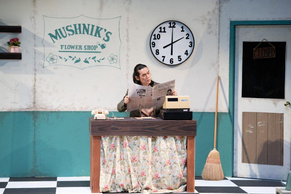 LSU vocal performance graduate student Mickey Zhang reads a newspaper Thursday, Feb. 1, 2024, as Mr. Mushnik in LSU Musical Theatre Club's performance of "Little Shop of Horrors" at the Reilly Theatre in Baton Rouge, La.