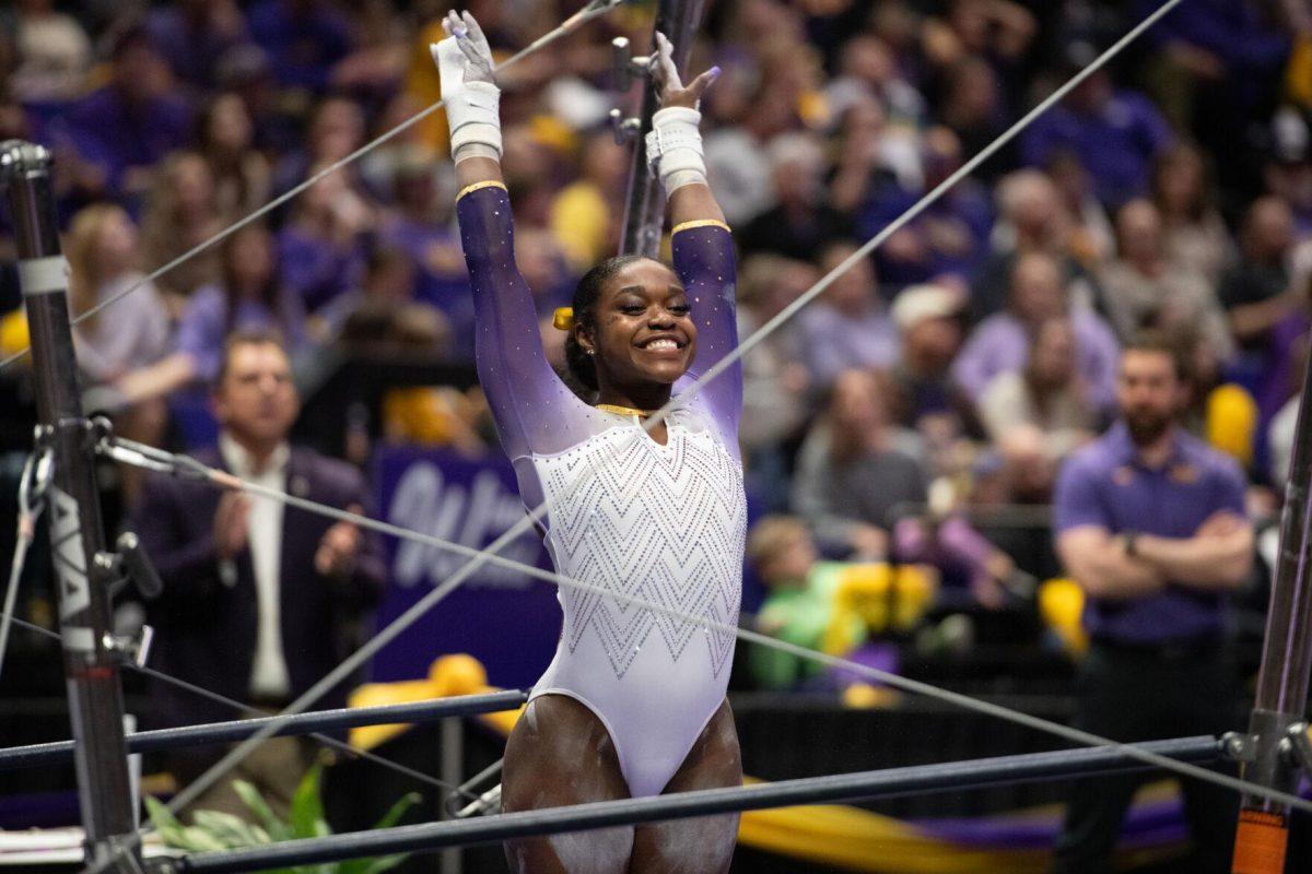 LSU gymnastics all-around graduate student Kiya Johnson prepares for her uneven bars routine Friday, Feb. 2, 2024, during LSU&#8217;s 198.475-196.200 win against Arkansas at the Pete Maravich Assembly Center in Baton Rouge, La.