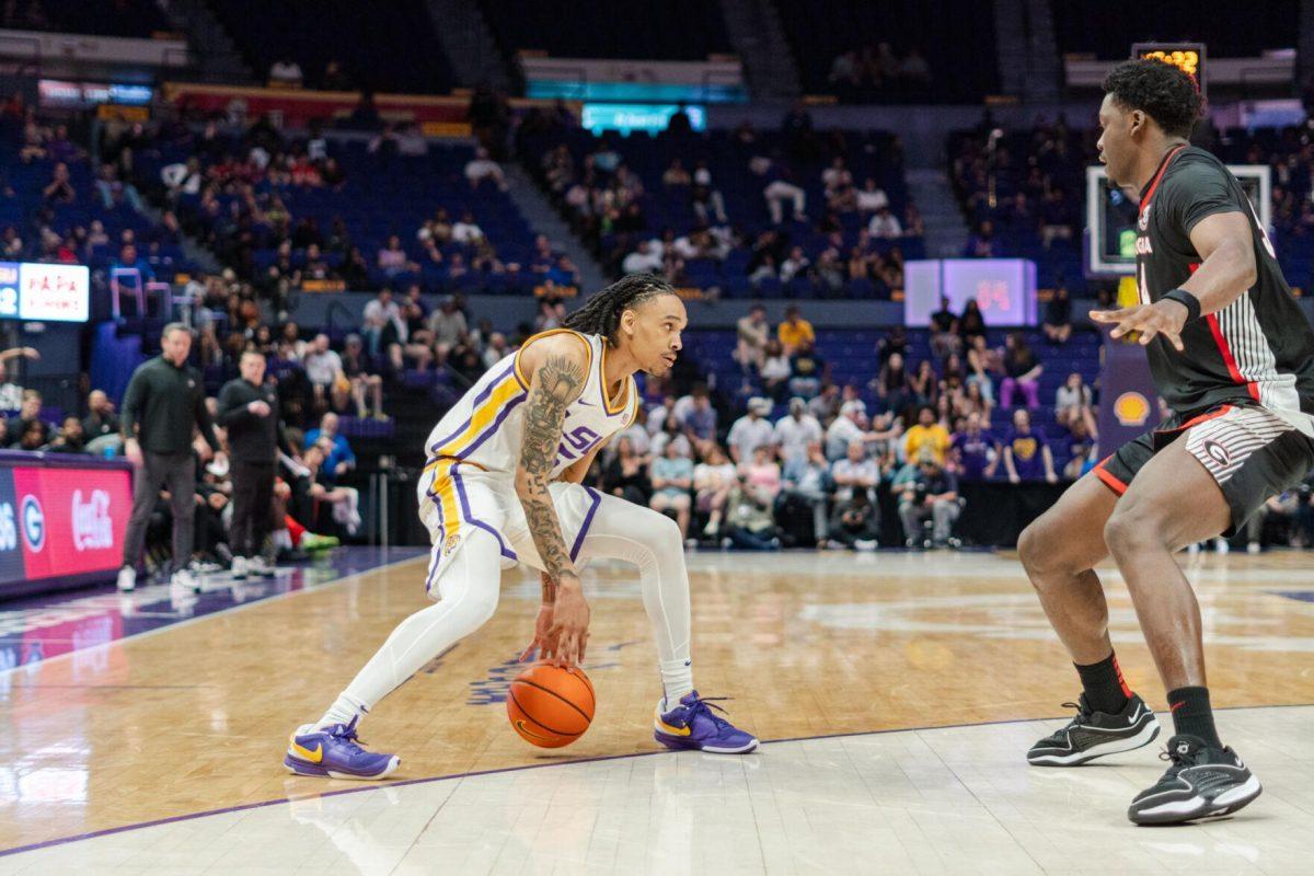 LSU men&#8217;s basketball sophomore forward Tyrell Ward (15) dribbles between his legs Tuesday, Feb. 27, 2024, during LSU&#8217;s 67-66 win against Georgia in the Pete Maravich Assembly Center in Baton Rouge, La.