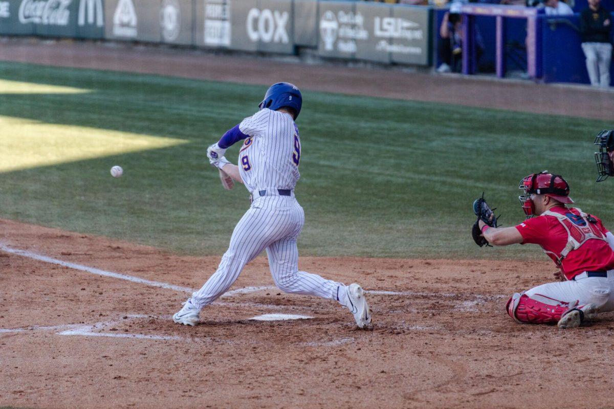 LSU baseball senior outfielder Mac Bingham (9) swings for the ball Friday, Feb. 23, 2024, during LSU&#8217;s 5-2 loss against Stony Brook at Alex Box Stadium in Baton Rouge, La.