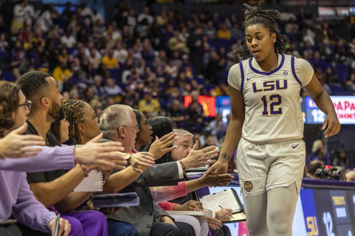 <p>LSU women's basketball freshman guard Mikaylah Williams (12) high-fives her coaches after being subbed off Thursday, Feb. 22, 2024, during LSU's 71-66 win over Auburn Pete Maravich Assembly Center in Baton Rouge, La.</p>