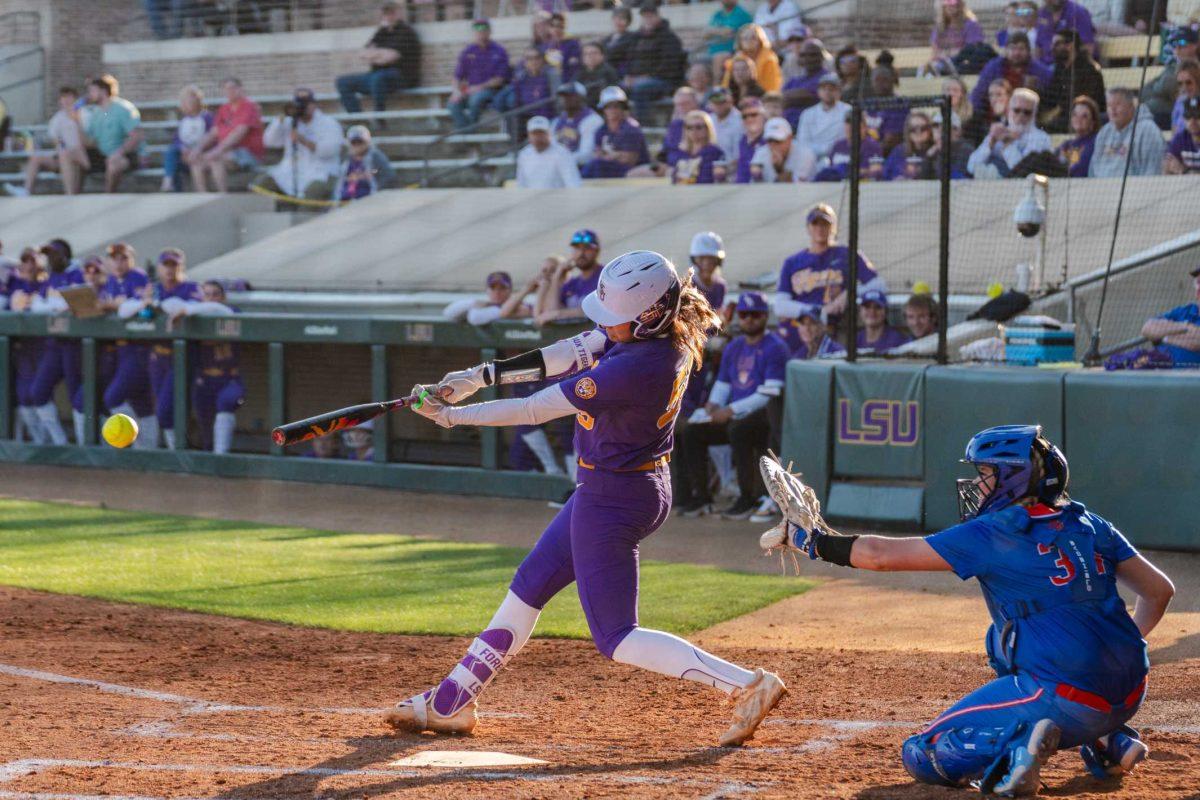 <p>LSU softball graduate student utility Raeleen Gutierrez (55) sends the ball flying Friday, Feb. 23, 2024, during LSU’s 8-5 win over Boise State at Tiger Park in Baton Rouge, La.</p>