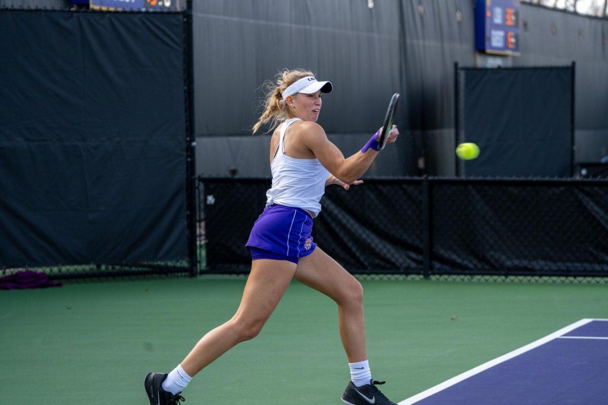 LSU women's tennis freshman Kenna Erickson hits a forehand during her 6-0, 6-4 singles win against Rice Sunday, Feb. 4, 2023 at the LSU Tennis Complex on Gourrier Avenue in Baton Rouge, La.