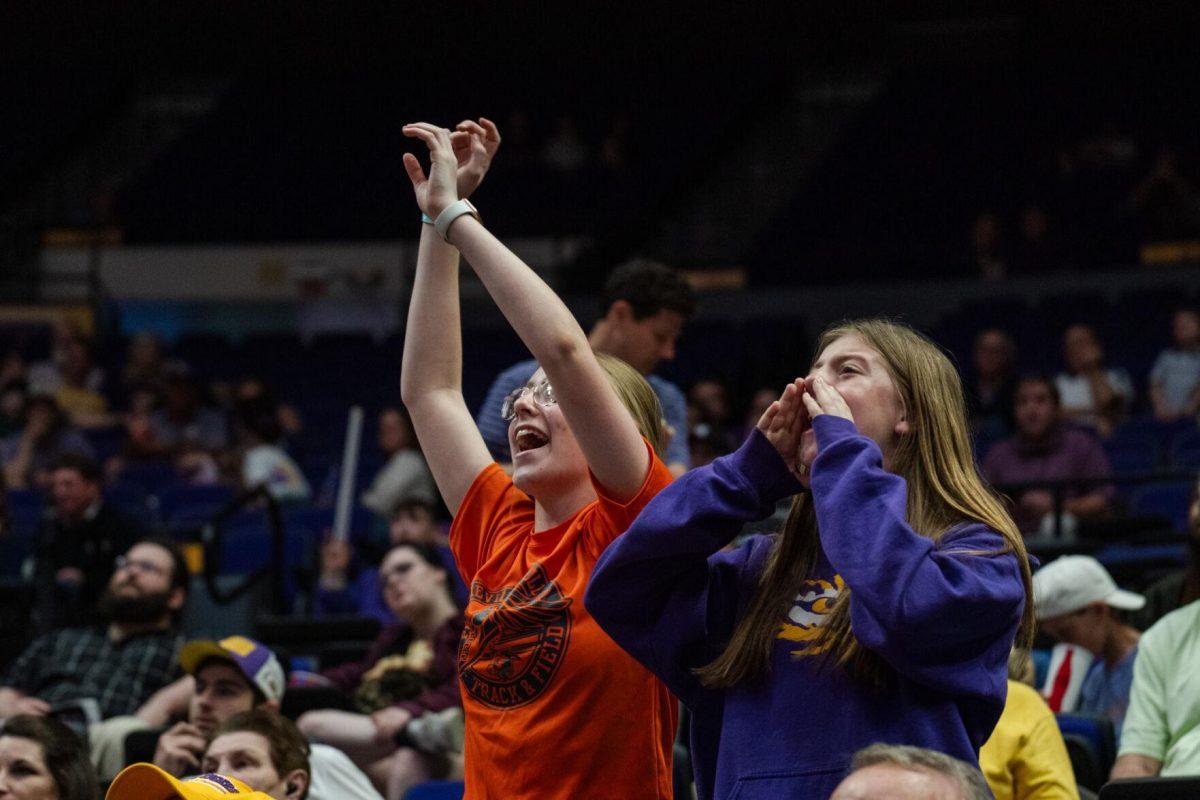 Two LSU fans make noise in hopes of distracting Georgia Tuesday, Feb. 27, 2024, during LSU&#8217;s 67-66 win against Georgia in the Pete Maravich Assembly Center in Baton Rouge, La.