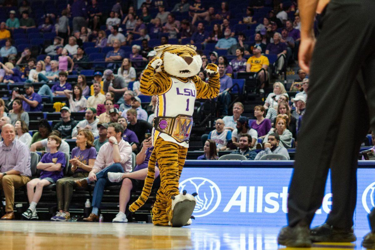 Mike the Tiger holds up his arms Tuesday, Feb. 27, 2024, during LSU&#8217;s 67-66 win against Georgia in the Pete Maravich Assembly Center in Baton Rouge, La.