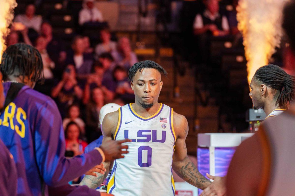 LSU men&#8217;s basketball 5th-year senior guard Trae Hannibal (0) high fives teammates Tuesday, Feb. 27, 2024, before LSU&#8217;s 67-66 win against Georgia in the Pete Maravich Assembly Center in Baton Rouge, La.