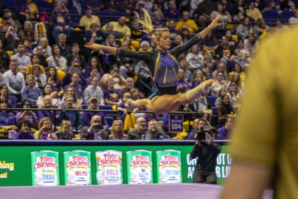 LSU gymnastics senior all-around Olivia Dunne flies through the air Friday, Feb. 16, 2024, during LSU's win 198.300-197.10 against Auburn in the Pete Maravich Assembly Center.