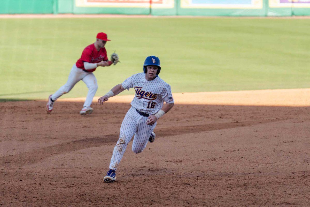 LSU baseball sophomore catcher Brady Neal (16) runs to third base Friday, Feb. 23, 2024, during LSU&#8217;s 5-2 loss against Stony Brook at Alex Box Stadium in Baton Rouge, La.