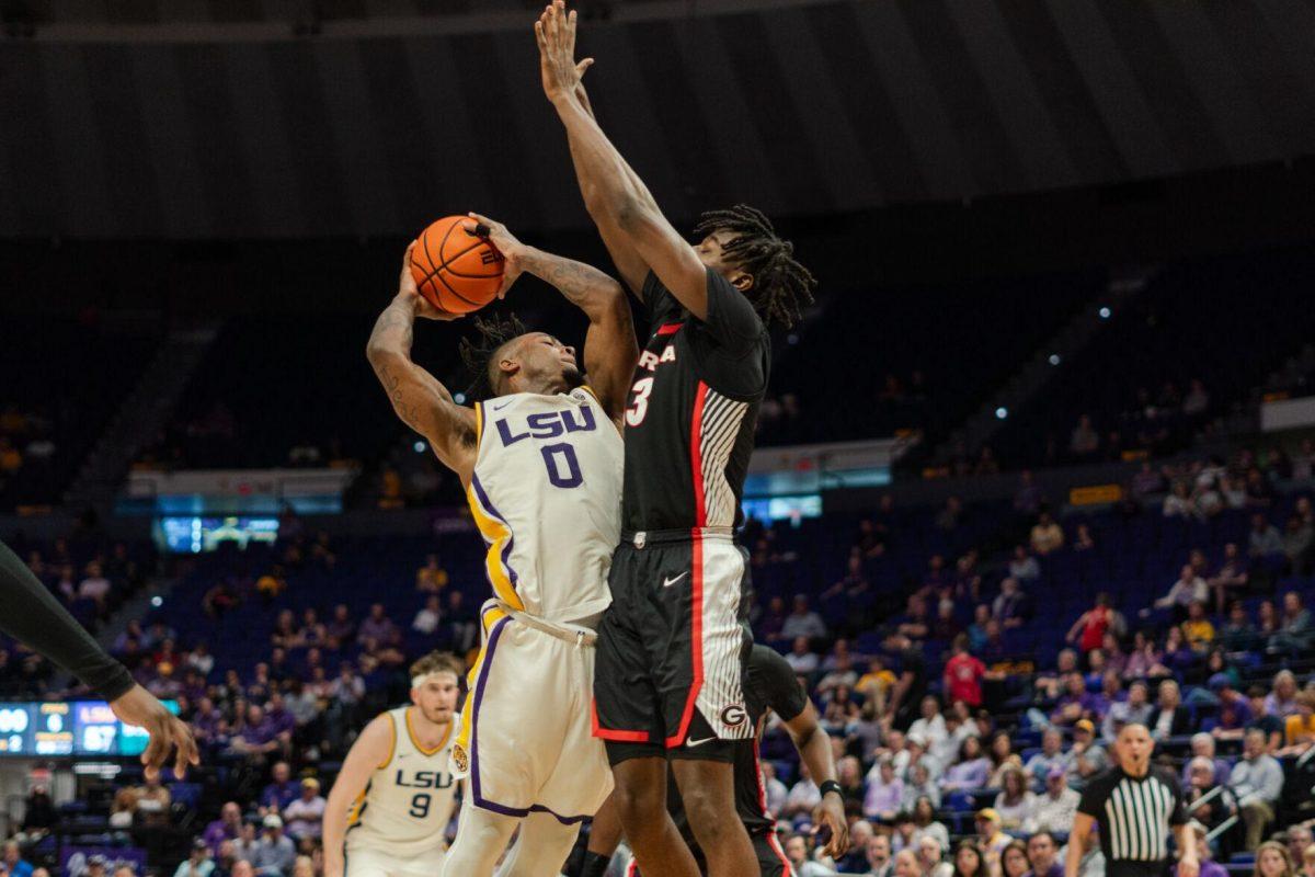 LSU men&#8217;s basketball 5th-year senior guard Trae Hannibal (0) leaps up with the ball in hand Tuesday, Feb. 27, 2024, during LSU&#8217;s 67-66 win against Georgia in the Pete Maravich Assembly Center in Baton Rouge, La.