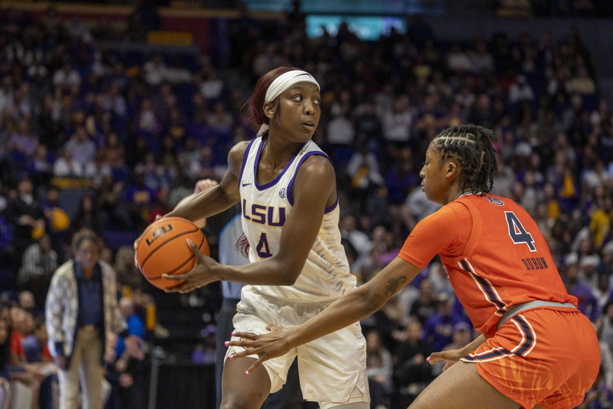 LSU women's basketball sophomore guard Flau'jae Johnson (4) searches for a pass Thursday, Feb. 22, 2024, during LSU's 71-66 win over Auburn Pete Maravich Assembly Center in Baton Rouge, La.