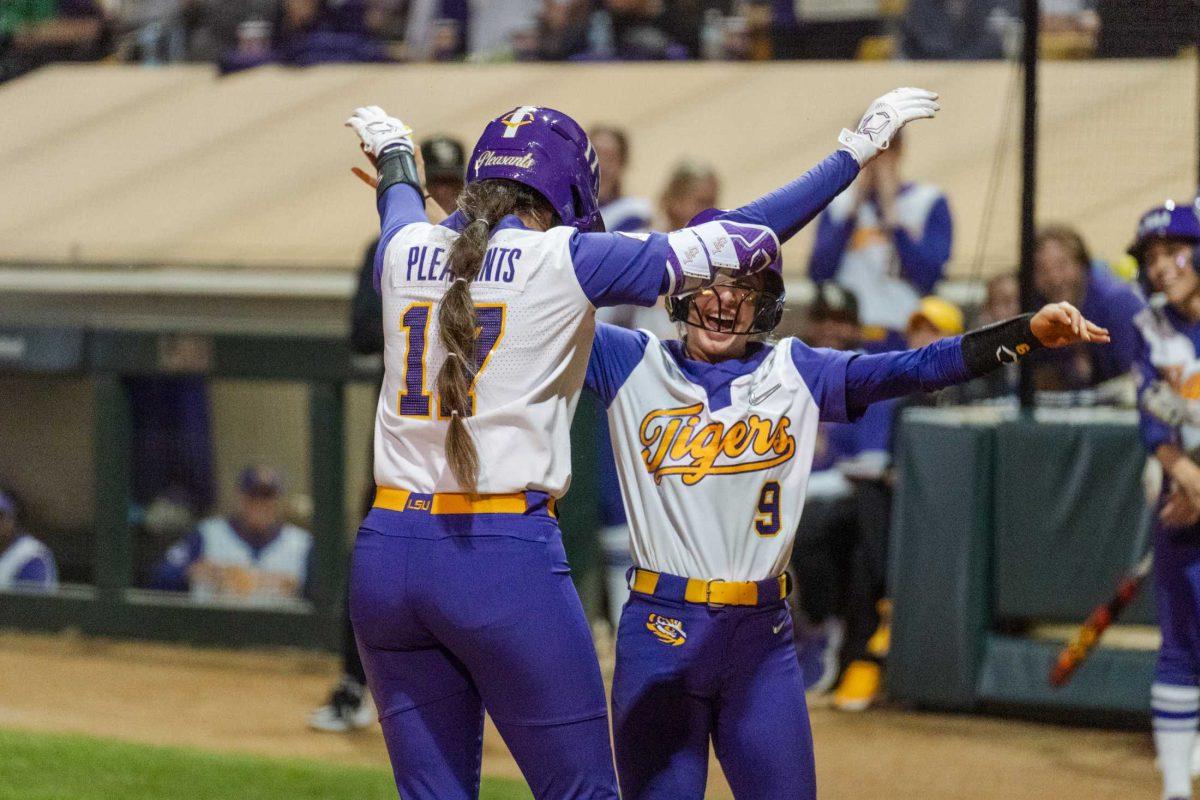 LSU softball graduate student infielder Taylor Pleasants (17) celebrates&#160;an inside-the-park grand slam with junior outfielder Madilyn Giglio (9) Thursday, Feb. 8, 2024, during LSU&#8217;s 8-0 win against Nicholls at Tiger Park in Baton Rouge, La.