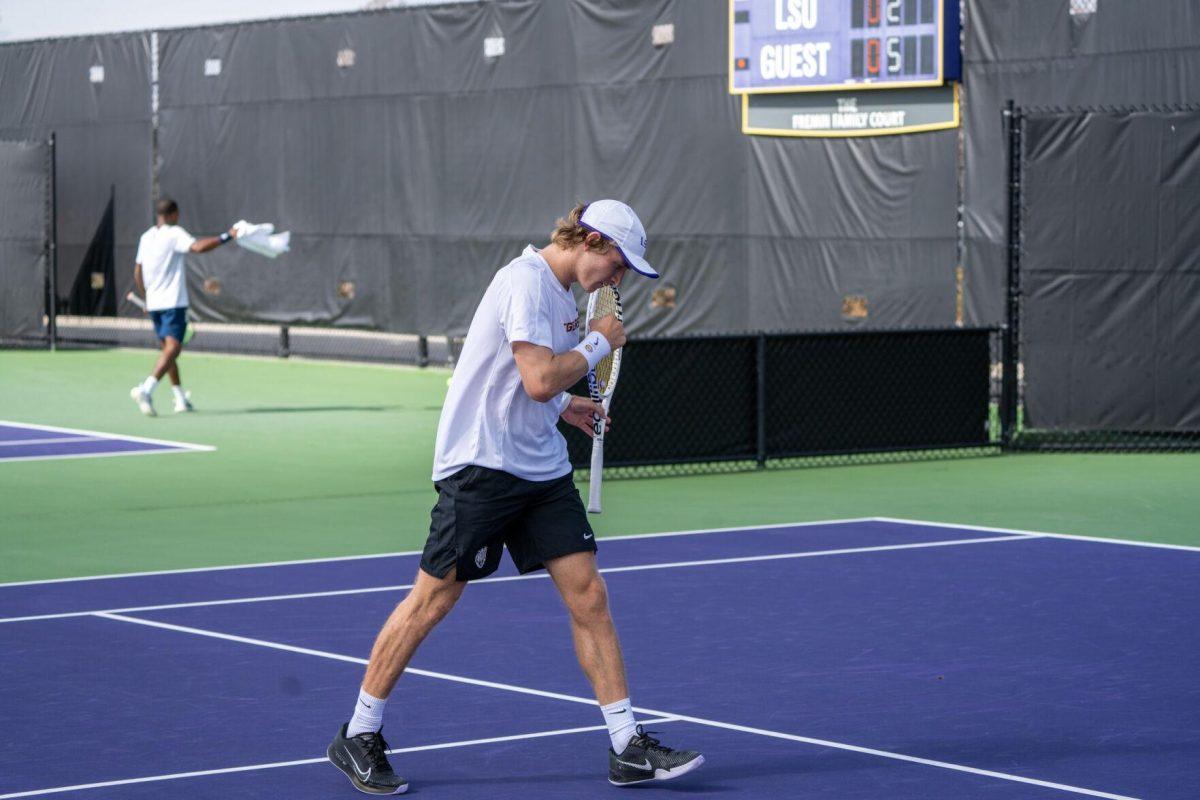 LSU men's tennis 5th-year senior George Stoupe pumps his fist during his 6-3, 3-6, 6-1 singles win against Rice Sunday, Feb. 4, 2023 at the LSU Tennis Complex on Gourrier Avenue in Baton Rouge, La.