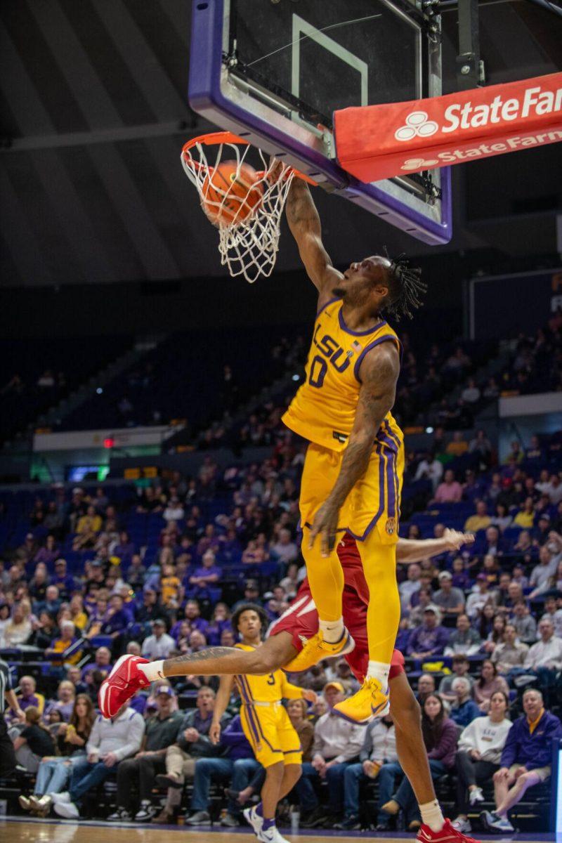 LSU men's basketball 5th-year senior guard Trae Hannibal (0) dunks the ball on Saturday, Feb. 3, 2024, during LSU's 94-74 win against Arkansas in the Pete Maravich Assembly Center in Baton Rouge, La.