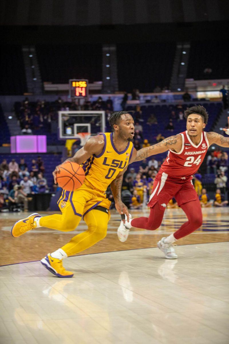 LSU men's basketball 5th-year senior guard Trae Hannibal (0) runs and dribbles the ball down the court on Saturday, Feb. 3, 2024, during LSU's 94-74 win against Arkansas in the Pete Maravich Assembly Center in Baton Rouge, La.