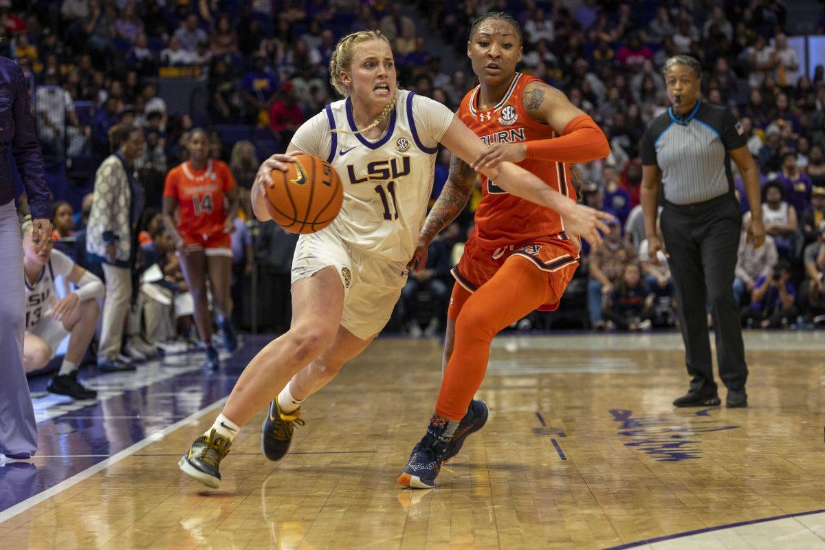 <p>LSU women's basketball graduate student guard Hailey Van Lith (11) dribbles through Auburn players Thursday, Feb. 22, 2024, during LSU's 71-66 win over Auburn Pete Maravich Assembly Center in Baton Rouge, La.</p>