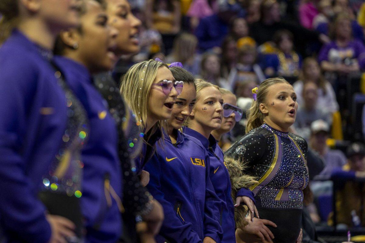 The LSU gymnastics watches on Friday, Feb. 16, 2024, during LSU's win 198.300-197.10 against Auburn in the Pete Maravich Assembly Center.