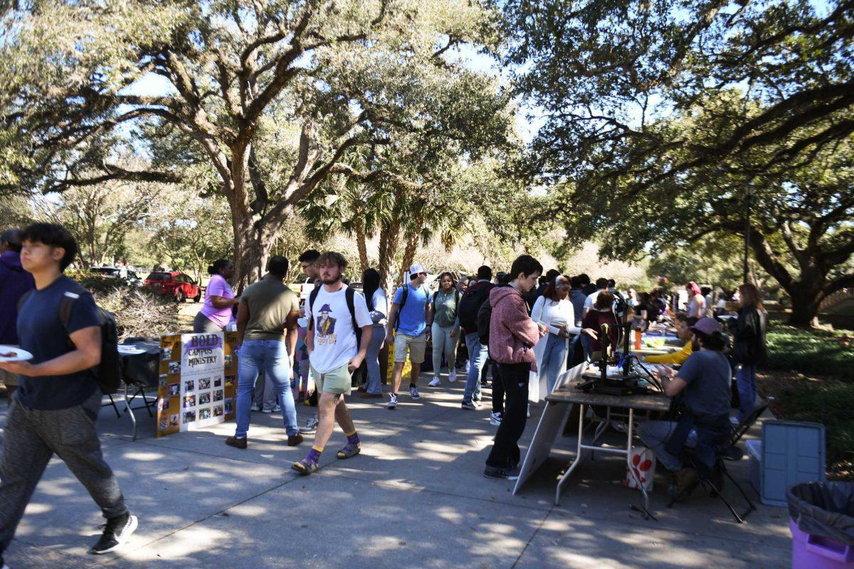 LSU students walk past tables at the Involvement Fest Wednesday, Jan. 31, 2024, in Free Speech Alley on LSU campus in Baton Rouge, La.