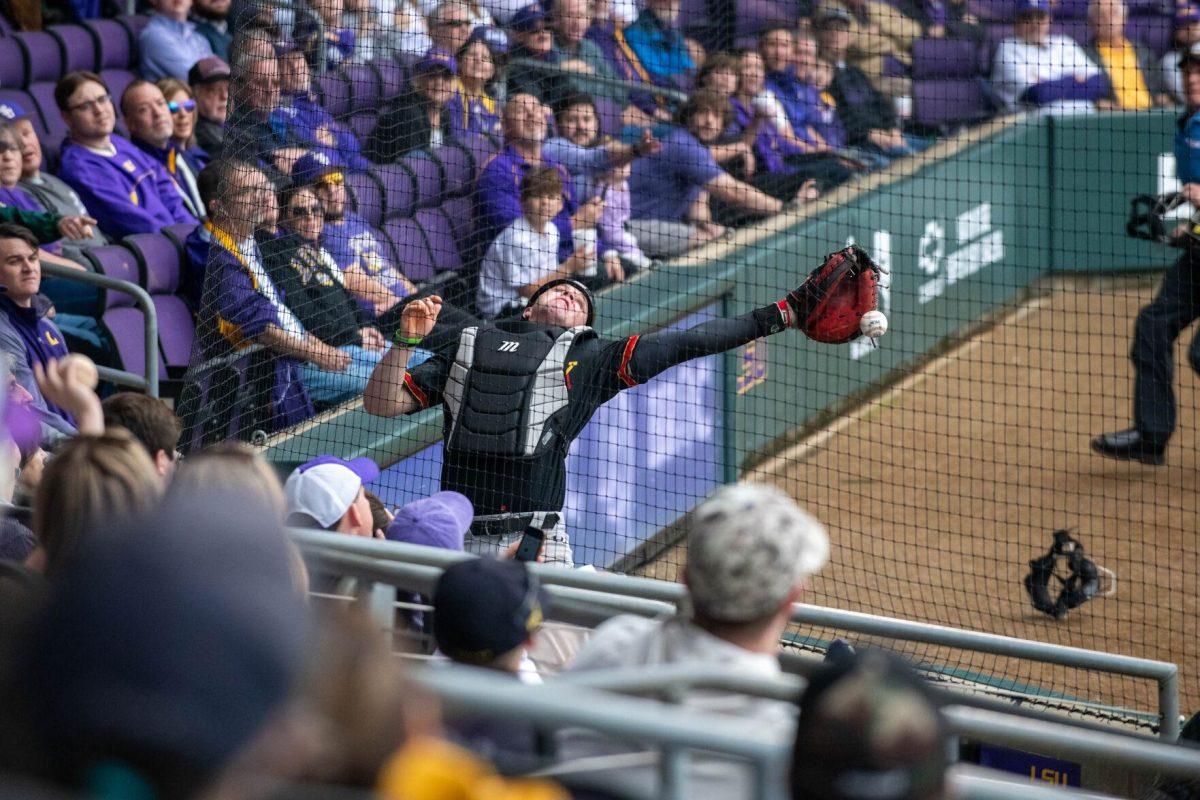 VMI baseball catcher misses the foul ball during LSU's 11-8 win against VMI on Friday, Feb. 16, 2024, at Alex Box Stadium in Baton Rouge, La.