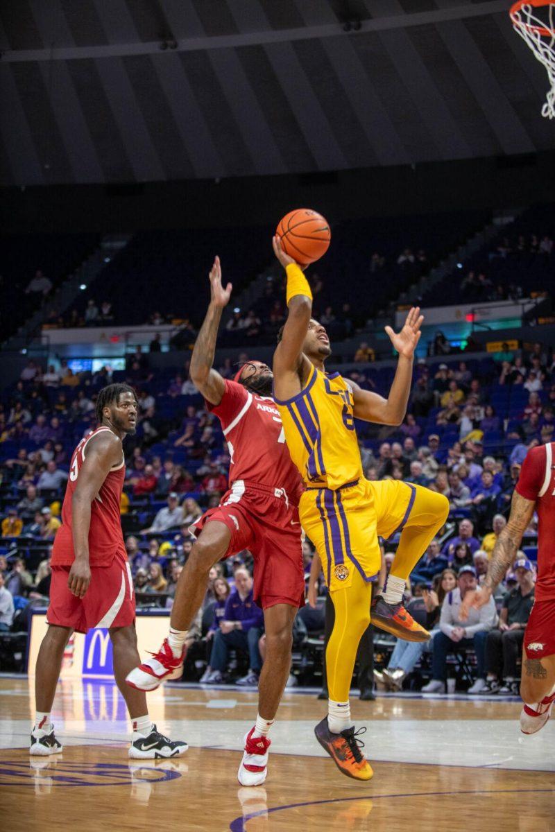 LSU men's basketball graduate student guard Jordan Wright (6) jumps to shoot the ball on Saturday, Feb. 3, 2024, during LSU's 94-74 win against Arkansas in the Pete Maravich Assembly Center in Baton Rouge, La.