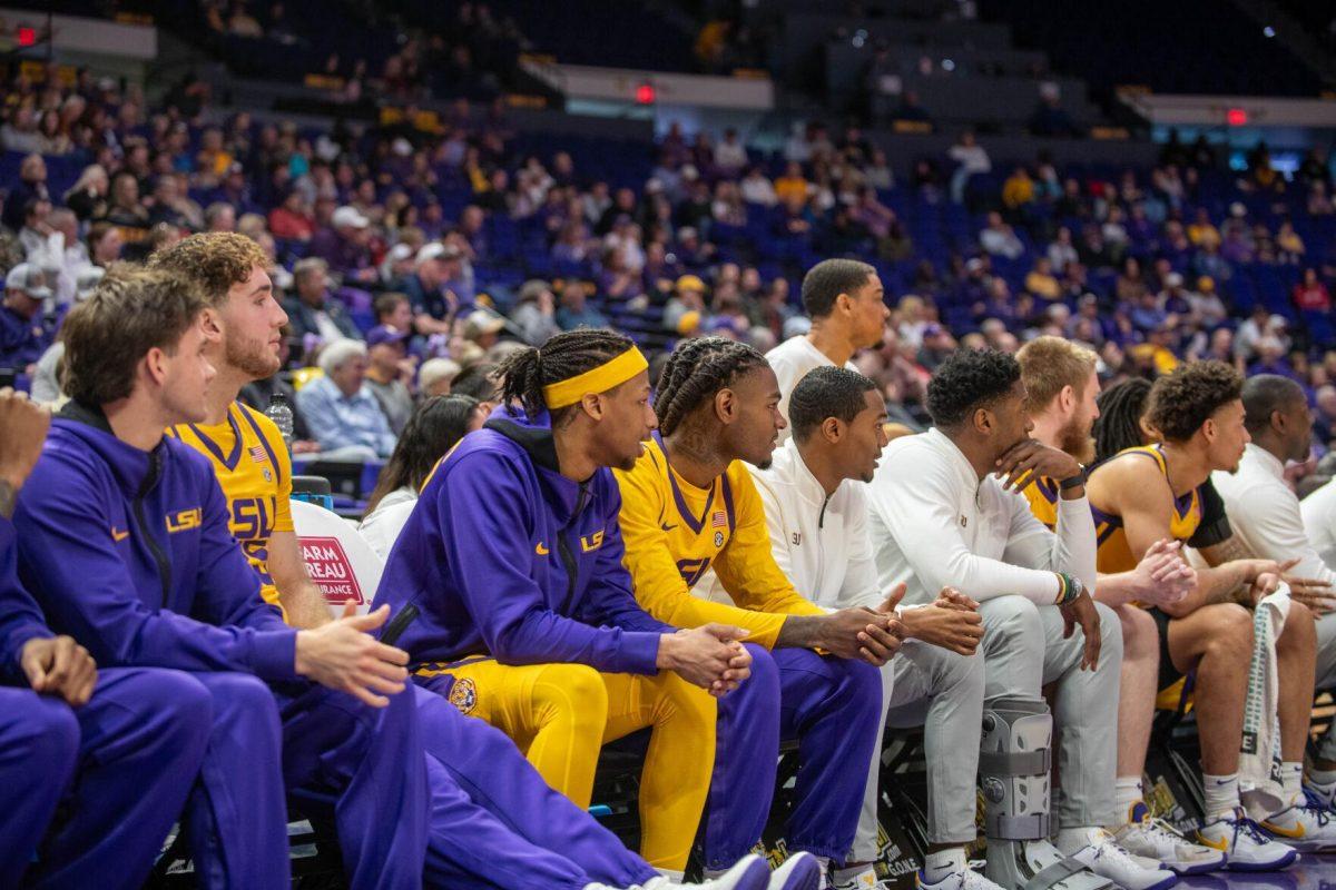 LSU men's Basketball team members and coaches watch the game from the sidelines on Saturday, Feb. 3, 2024, during LSU's 94-74 win against Arkansas in the Pete Maravich Assembly Center in Baton Rouge, La.