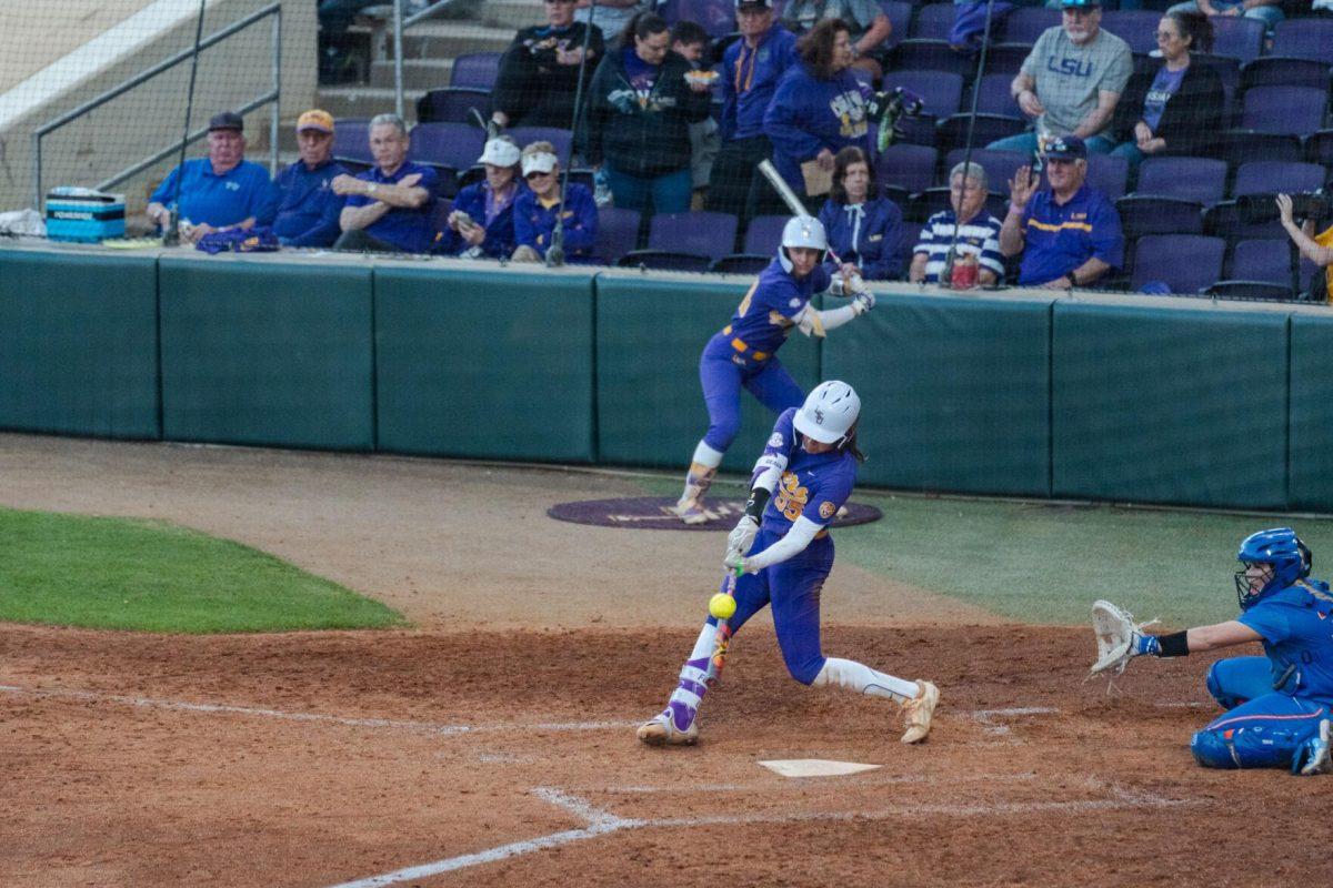 LSU softball graduate student utility Raeleen Gutierrez (55) connects with the ball Friday, Feb. 23, 2024, during LSU&#8217;s 8-5 win over Boise State at Tiger Park in Baton Rouge, La.