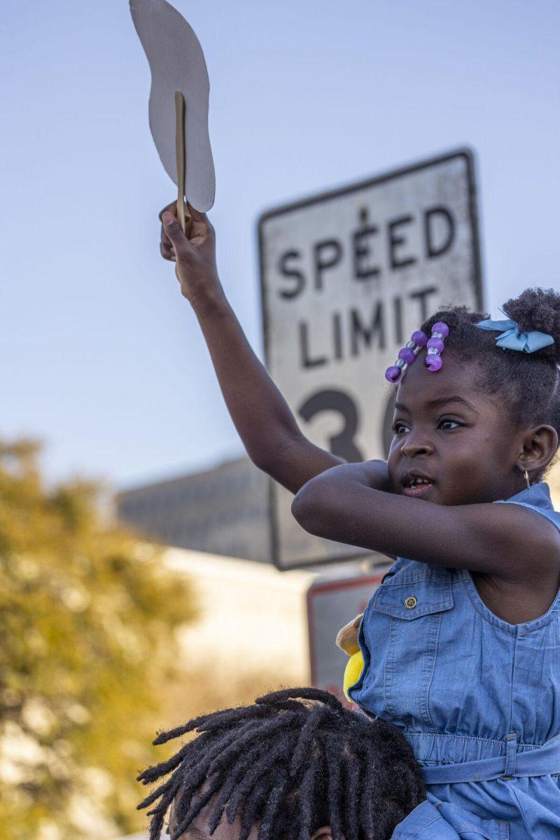 A child watches the Southern Lotus lion dance performance Sunday, Feb. 25, 2024, during the second annual 225Fest 2024 at 660 N. Fourth St. in Baton Rouge, La.