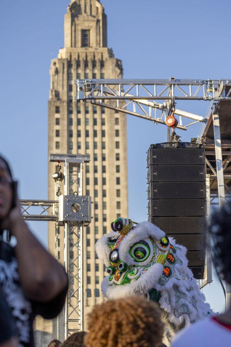 A Southern Lotus lion plans out its next move Sunday, Feb. 25, 2024, during the second annual 225Fest 2024 at 660 N. Fourth St. in Baton Rouge, La.