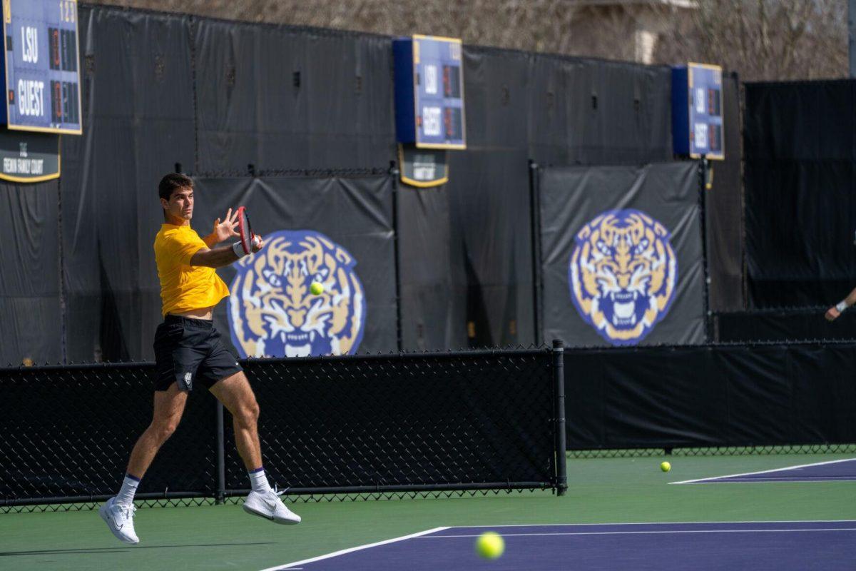 LSU men's tennis 5th-year senior Stefan Latinovic hits a forehand during his 6-3, 7-6 singles win against Rice Sunday, Feb. 4, 2023 at the LSU Tennis Complex on Gourrier Avenue in Baton Rouge, La.