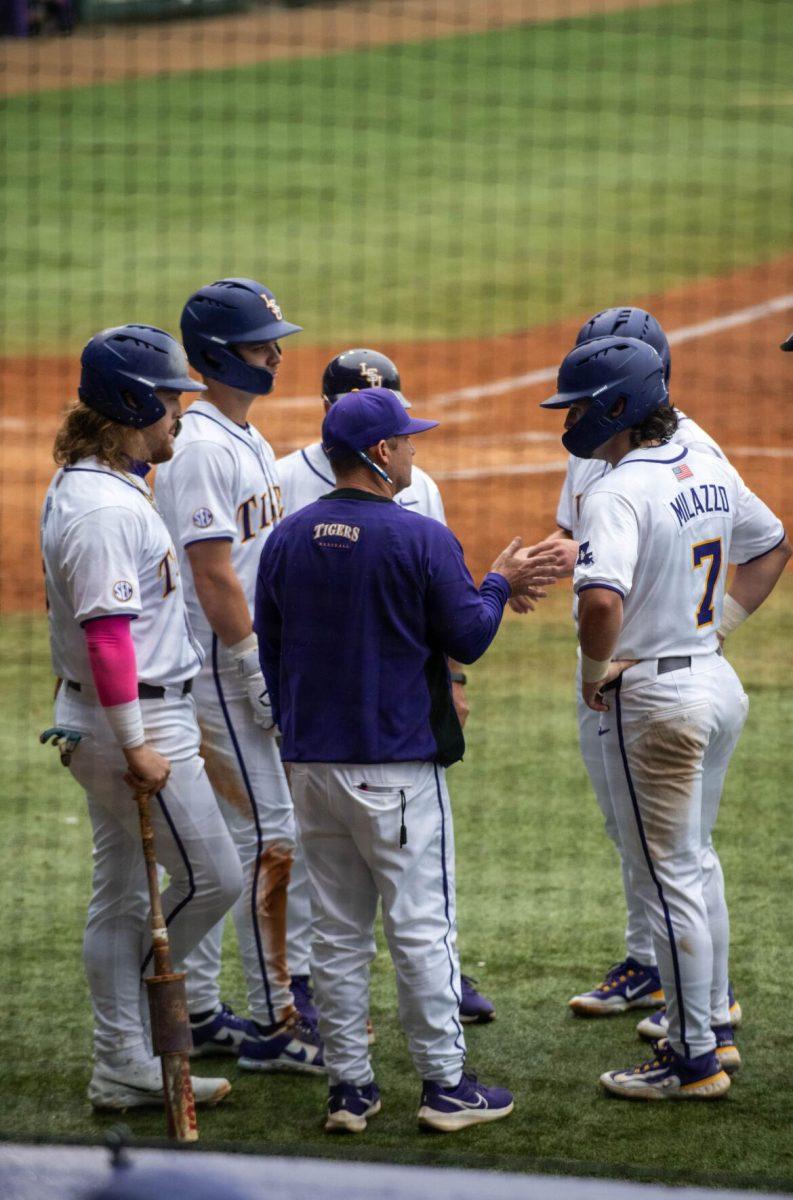 LSU baseball head coach Jay Johnson talks to a few player during LSU's 11-8 win against VMI on Friday, Feb. 16, 2024, at Alex Box Stadium in Baton Rouge, La.