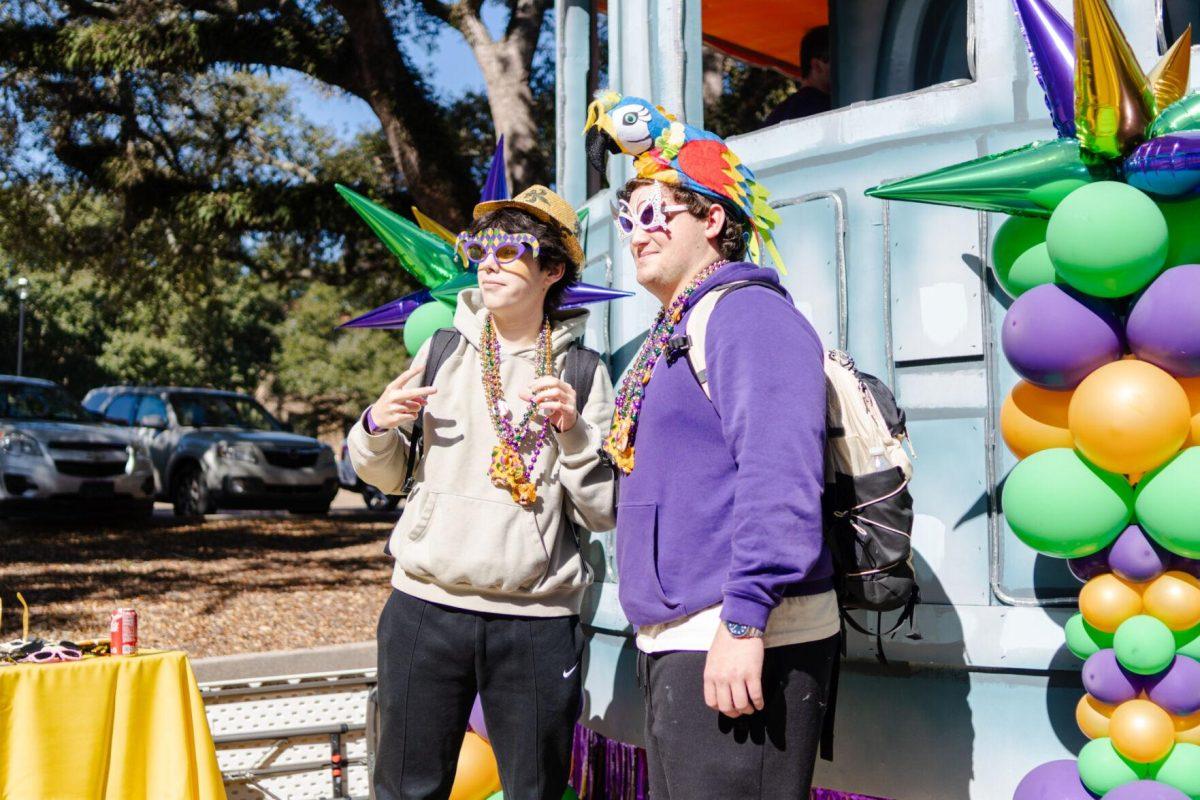 LSU business/pre-law freshman Mason Murray (left) and general business freshman William Hudspeth (right) pose for a photo at the photo booth Tuesday, Feb. 6, 2024, during Campus Life's Mardi Gras Mambo event on Tower Drive.